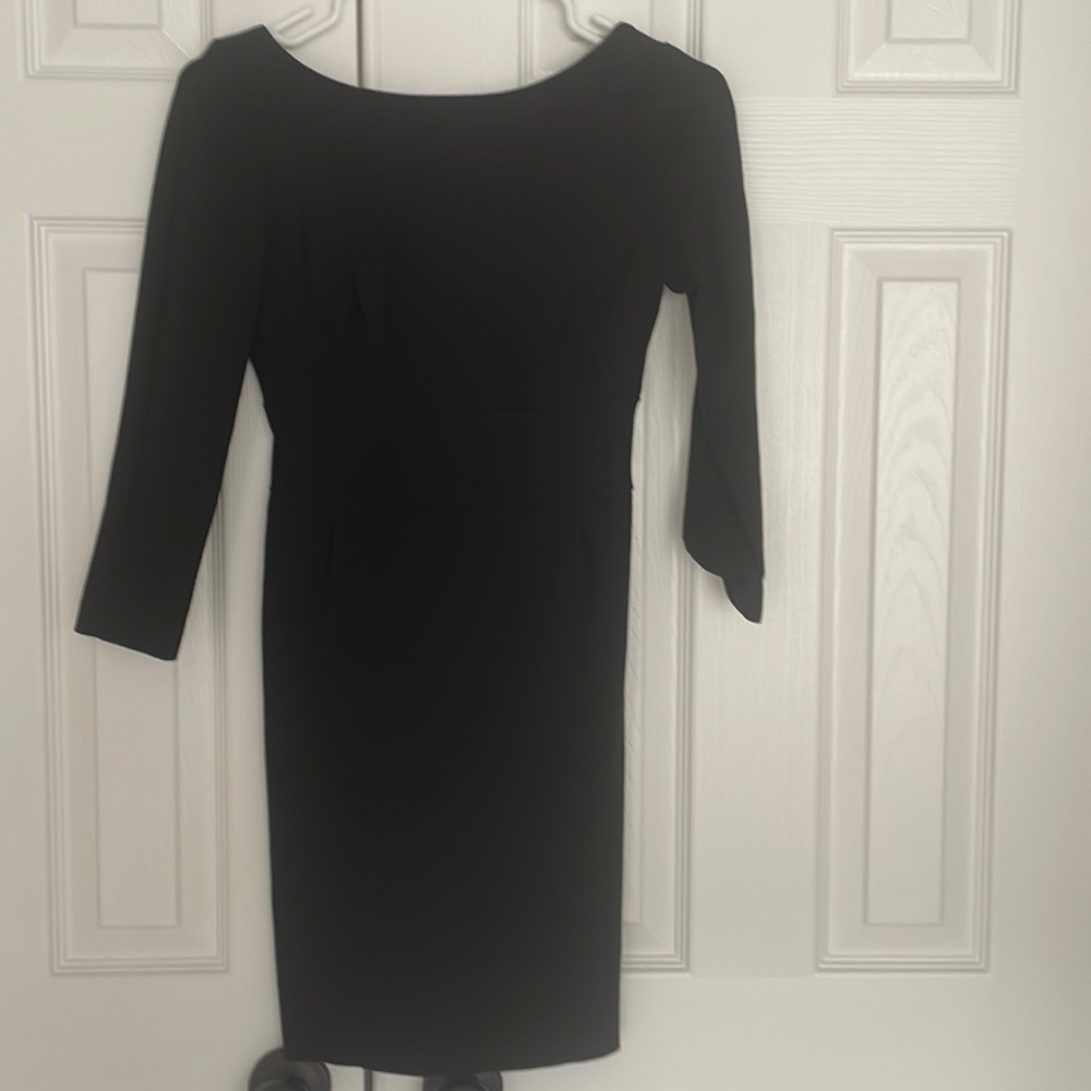 Mini little black dress with open back and 3/4 sleeves